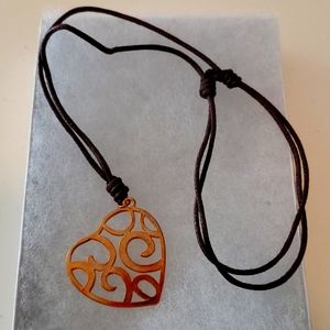 Rose gold heart pendant on soft brown adjustable necklace